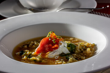 Traditional russian soup - okroshka with fresh vegetables, meat and kvass. Cold summer soup on white table.