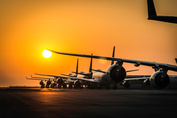 Sunset at Airport with Jumbo airplanes line up 