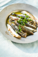 Traditional Spanish pintxos of Cantabrian anchovies in olive oil