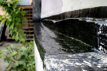 Building retaining wall repair with waterproofing product. Fixing old cracked backfilled wall from...