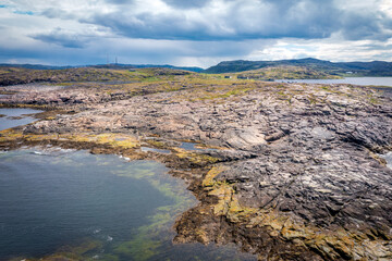 Summer tundra. Rocky coastline of Barents Sea near Teriberka, panoramic aerial view. Scenery of Russian North. Kola Peninsula, Murmansk Oblast, Russia