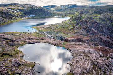 Naklejka premium Summer tundra. Rocky coastline of Barents Sea near Teriberka, panoramic aerial view. Scenery of Russian North. Kola Peninsula, Murmansk Oblast, Russia