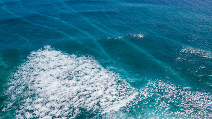Aerial view of big turquoise wave of Indian ocean in Maldives. Exotic tropical landscape from above. Summer holiday or vacation travel concepts