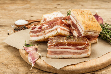 Pieces of salty high-fat meat cooked with spices. Salo, bacon, lard, silverside, gammon