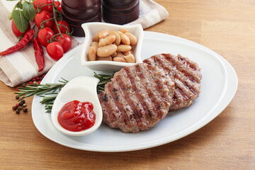 Grilled beef burger cutlet with sauce