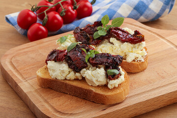 Bruschetta with soft cheese and tomato
