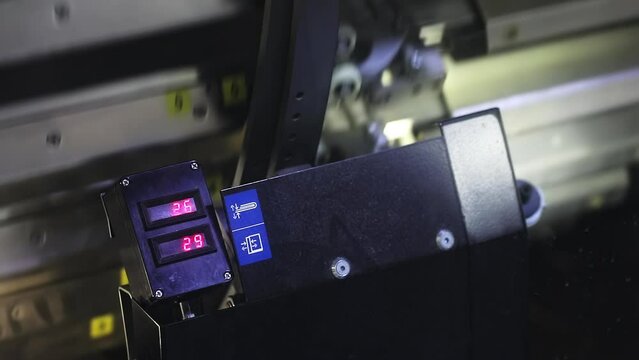 The printing process of a newspaper's production business. Composed and proofed newspaper sent electronically to a shop with complex equipment. High quality FullHD footage