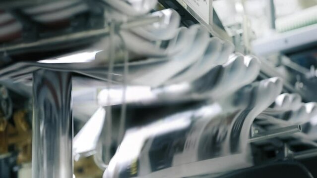 Offset printing on fully automated equipment with a belt and conveyor. Complex machine spewing newspaper copies to the waiting distribution division. High quality FullHD footage