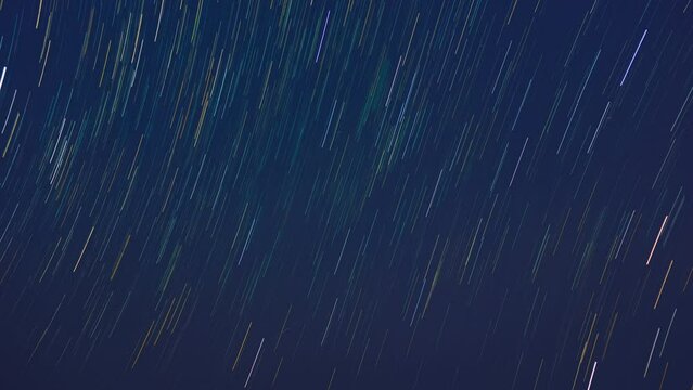 Beautiful winter scene in Timelapse 4K video with star trails. On top of a pine tree at a camping spot in Huai Nam Dang National Park, it is very beautiful. Chiang Mai Province, Thailand