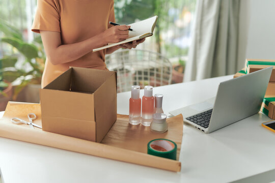 Close-up of preparing a parcel on the table.