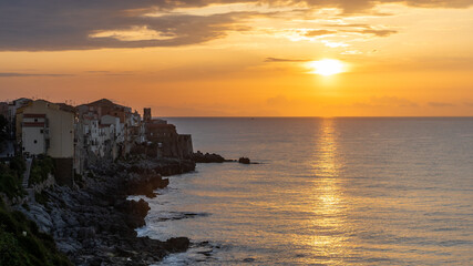 Fototapeta premium sunset over the sea at old european city
