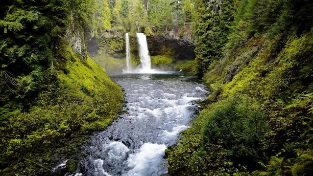 Aerial shot of the amazing Koosah Falls and lush moss covered forest on the McKenzie River in Oregon.