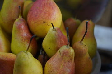 Almaty, Kazakhstan - 03.25.2022 : Fresh pears are on sale at the market.
