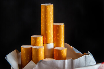 Close up cigarette in pack is addictive to be cancer.smoking reduction campaign in World No Tobacco Day