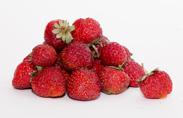 Strawberries on a white background. Strawberry close-up isolated. Juicy berries picked for dessert.