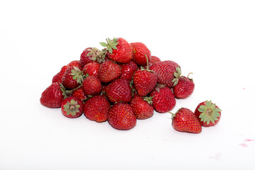 Strawberries on a white background. Strawberry close-up isolated. Juicy berries picked for dessert.