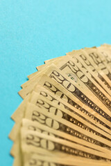 Big amount of old twenty dollar bills on blue background. Money earnings, payday or tax paying...