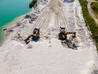 heavy industry overhead view of excavator at sand quarry