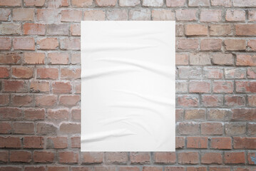 Poster mockup on brick wall with crumpled texture