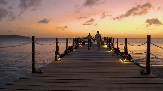 St Lucia Caribbean, couple men and women on vacation,Huge pitons drone view at Saint Lucia sugar beach St Lucia mountains at the beach with clear ocean