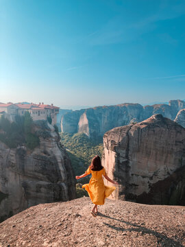 beautiful woman in yellow dress at greece thessaly mountains