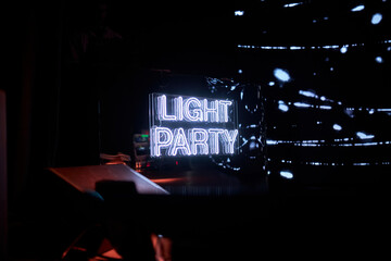 White neon sign Light Party. White neon inscription Light Party at the party