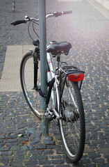 Retro styled bicycle parked in the street.