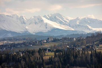 Landscape in the Polish Tatra Mountains. View of the snow-capped peaks in April.