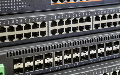 connectors of a large data center network switch. incoming and outgoing outputs