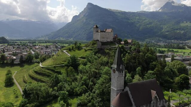 Aerial shot of St. Nikolaus church and Gutenberg Castle, Balzers, Liechtenstein
