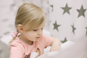Naklejka premium Little toddler girl in bathroom washing hands. Healthy, Child Hygiene concept.