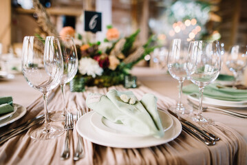 Amazing wedding table decoration with flowers on a round festive table