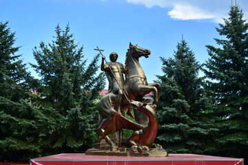 sculpture of St.George on horseback slaying a snake
