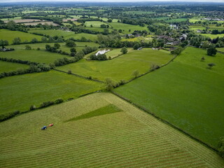 Mowing grass for silage in English countryside