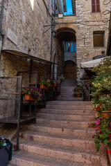 Fototapeta na wymiar ASSISI, ITALY, 6 AUGUST 2021 Ancient street in the historic center