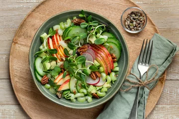 Fototapeten Healthy apple, celery cucumber, radish and microgreens salad © anna_shepulova