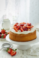 strawberry  cake with cream cheese frosting and fresh berries
