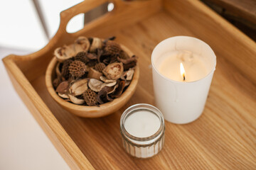 Aroma Potpourri and candle on wooden table, eco aromatic home decor and apartment living decorative bowl. yoga, scent, smelling good, candles