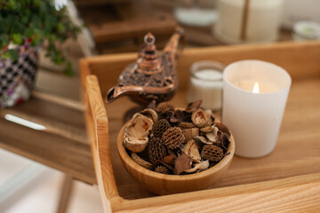 Aroma Potpourri and candle on wooden table, eco aromatic home decor and apartment living decorative...