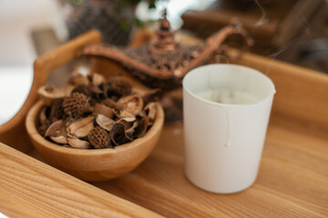 Aroma Potpourri and candle on wooden table, eco aromatic home decor and apartment living decorative bowl. yoga, scent, smelling good, candles