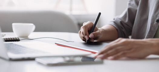 Young woman using laptop computer at office panoramic banner. Student girl working at home. Work or study from home, freelance, business, designer lifestyle concept