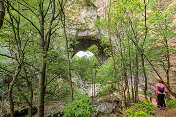 Imposing natural stone arches, Geomorphological natural monument. Vratna River Canyon, eastern Serbia. Amazing nature landscape. Spring day. 
