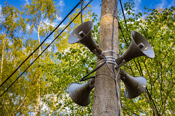 loudspeaker mounted on a lamppost in the park (Corrected)