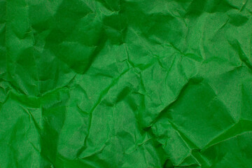 Crumpled green paper craft textured background