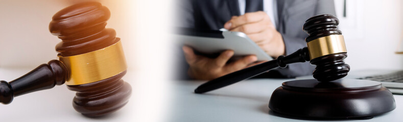 justice and law concept.Male judge in a courtroom on wooden table and Counselor or Male lawyer working in office. Legal law, advice and justice concept.