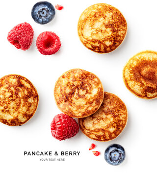 Pancake and fresh berry creative layout.