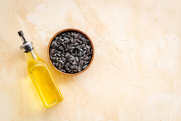 Sunflower oil in bottle with seeds. Cooking oil background