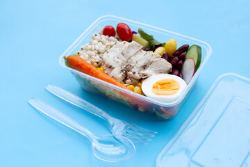 Salad with meat and vegetables in plastic package box