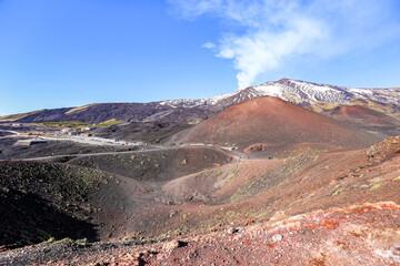 Slope of Etna volcano with steam rising from the crater, Sicily, Italy