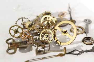 Turning cogwheels. Clock mechanism, gears, wheels, wristwatch parts close-up